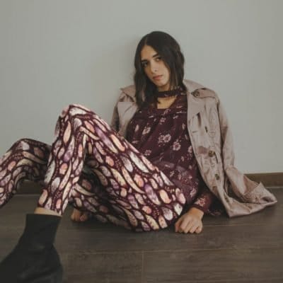 bird-feather-leggings-mockup-of-a-fashionable-girl-lying-on-the-floor-against-a-wall bird-feather-leggings-mockup-of-a-fashionable-girl-lying-on-the-floor-against-a-wall